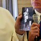 Pope Francis holds a picture depicting a victim of the 1945 atomic bombing in Nagasak.
